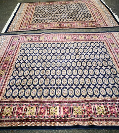 A pair of modern Persian blue ground carpets 270 x 202cm